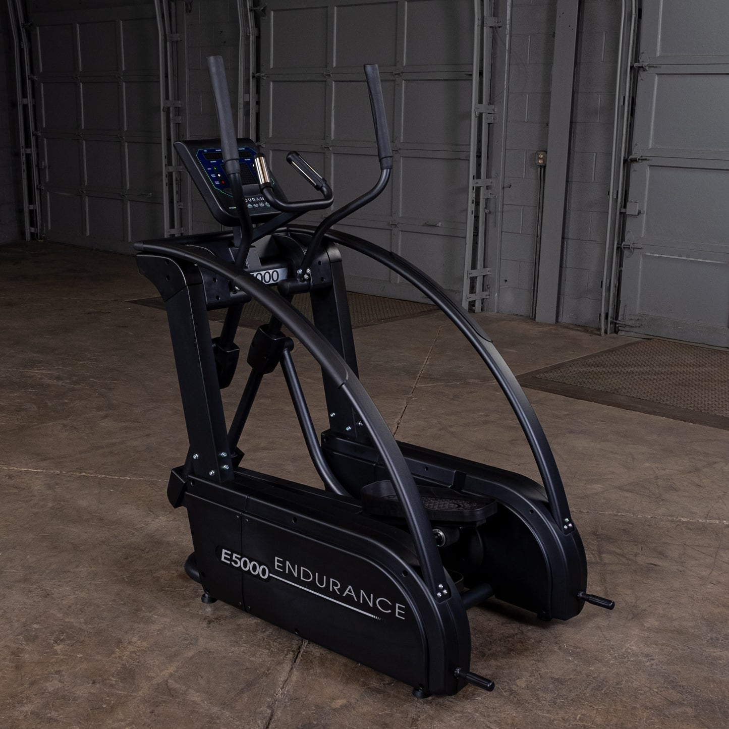 Endurance by Body-Solid E5000 elliptical trainer side view showing center drive and compact footprint