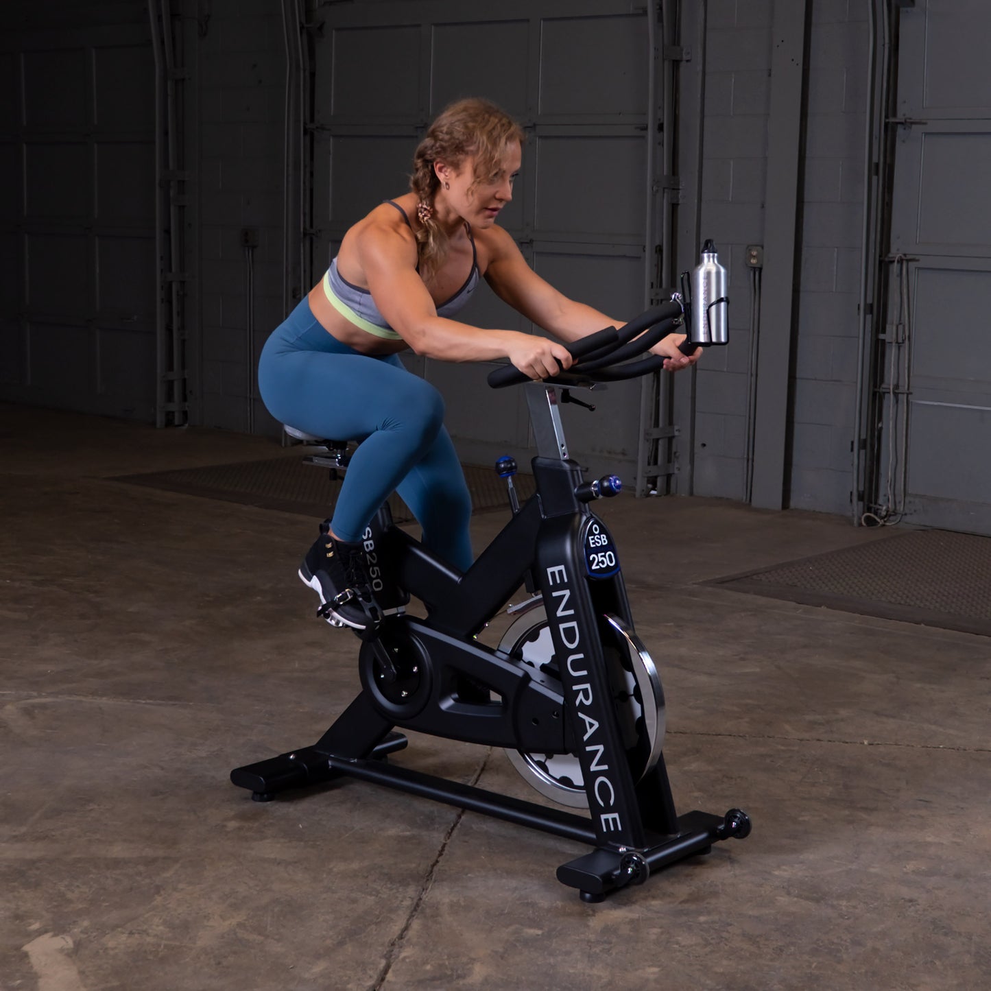 Woman spinning on the Body-Solid Endurance ESB250 spin bike