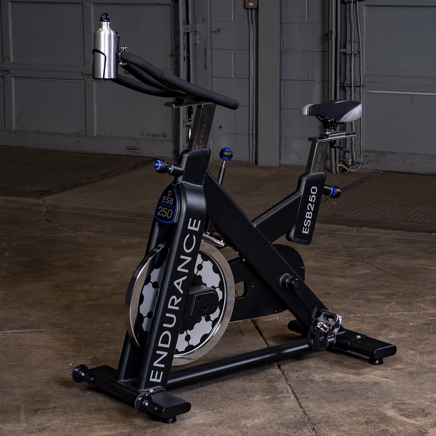 Side view of the Endurance by Body-Solid ESB250 Spin Bike showing flywheel and frame