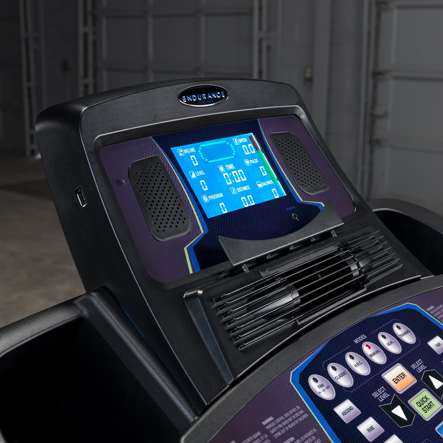 Close-up of LED display console on Body-Solid Endurance T150 with speed, distance, and incline settings