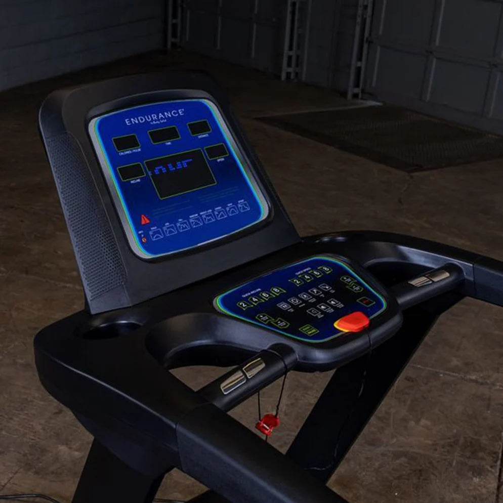 Close-up of the Endurance T25 LED console with speed, time, and workout program controls.