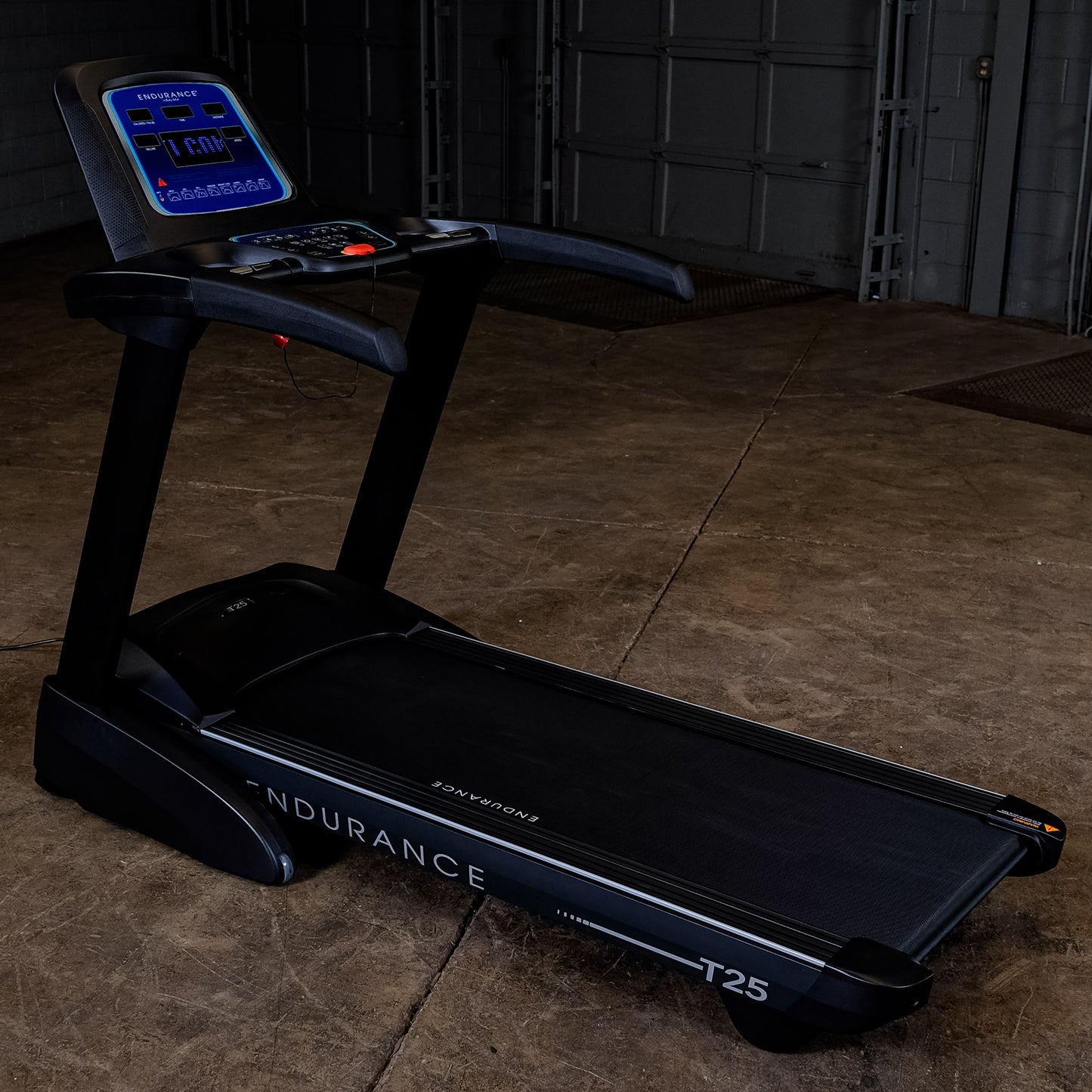 Side view of the Body-Solid Endurance T25 Folding Treadmill showing compact design and running deck.
