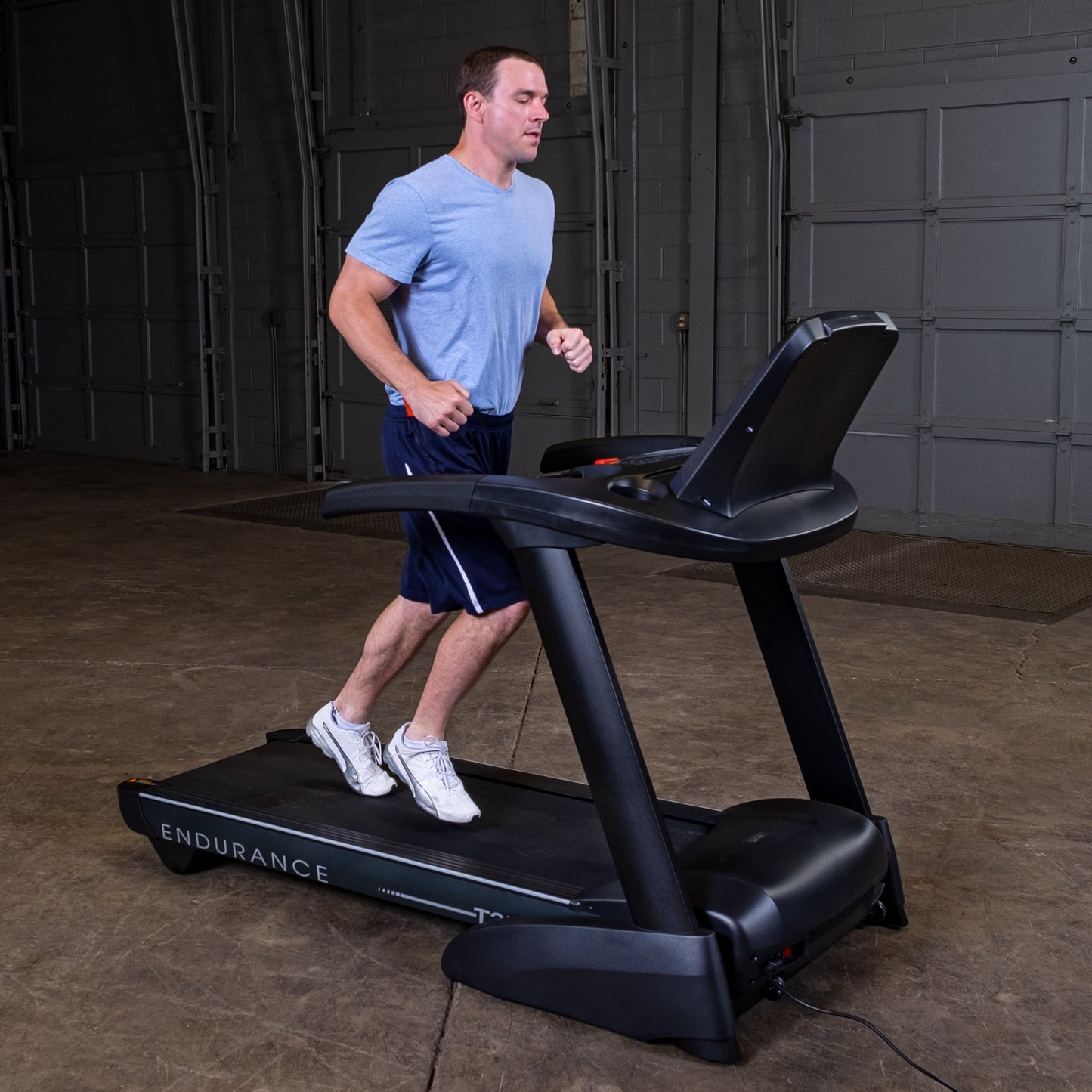Close-up of shock-absorbing deck on the Body-Solid T25 for low-impact cardio sessions.
