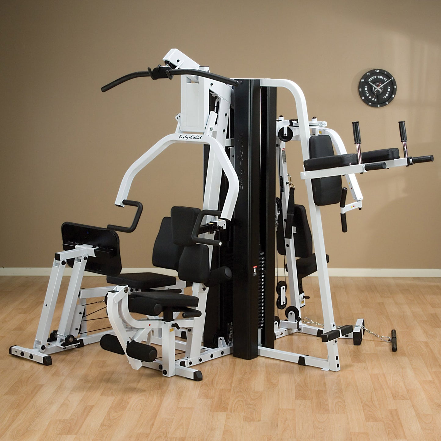 Body-Solid EXM3000LPS multi-stack gym with three weight stacks for simultaneous training.