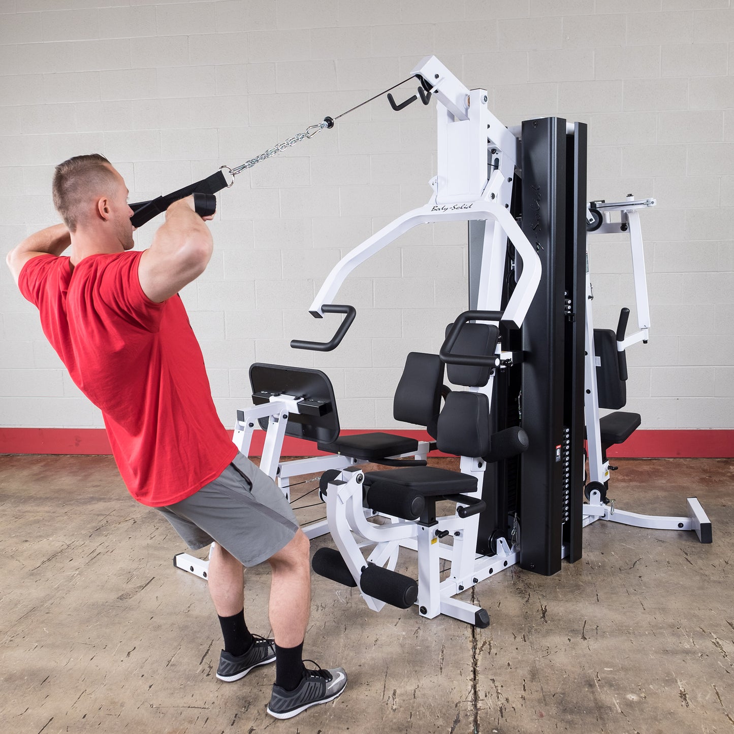 Body-Solid EXM3000LPS pec dec and press arm station for chest and shoulder exercises.