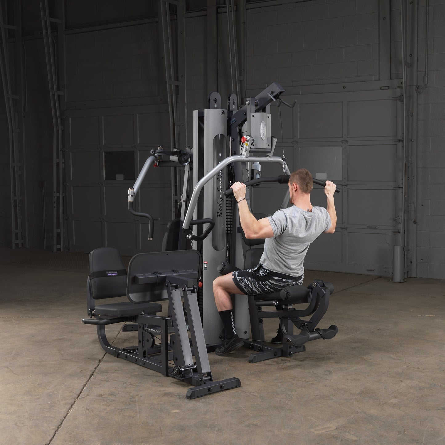 Lat pulldown and low row cable stations with ergonomic seat and pulleys on the Body-Solid G9S Two Stack Gym
