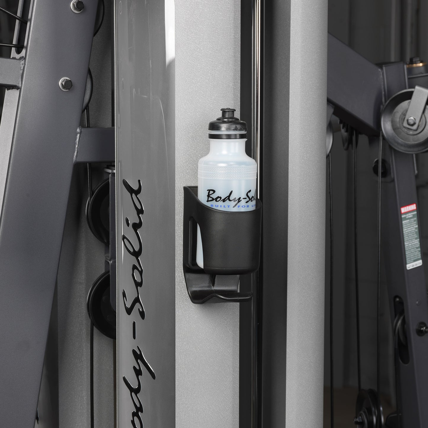 Close-up of the water bottle holder on the Body-Solid G9S Two Stack Gym