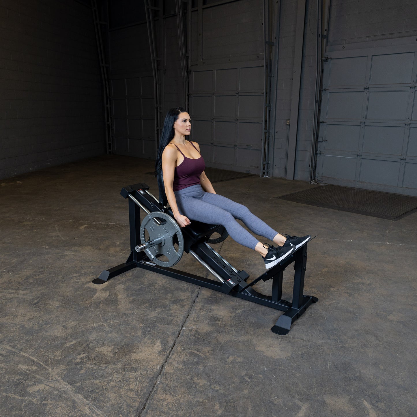 User performing leg press on Body-Solid GCLP100