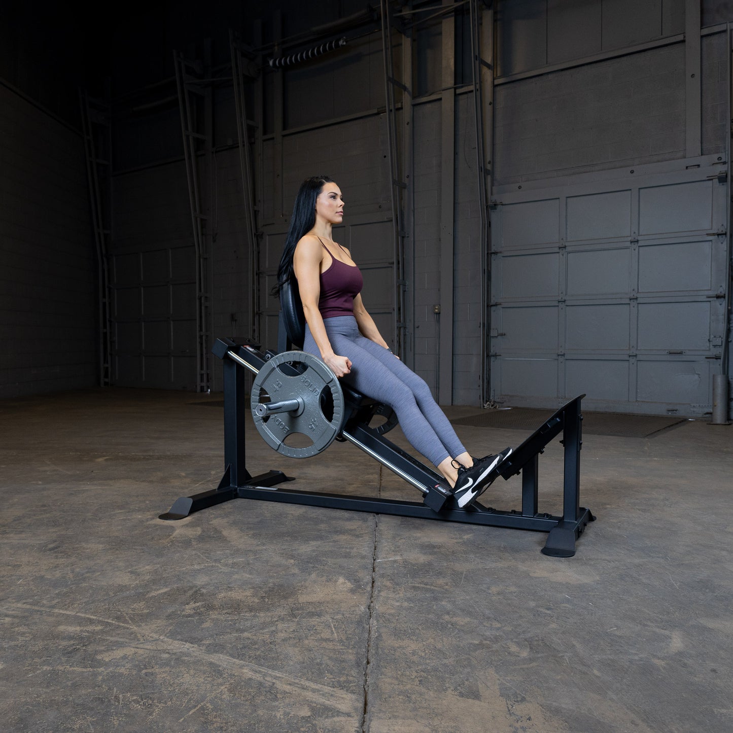 User performing calf raise on Body-Solid GCLP100