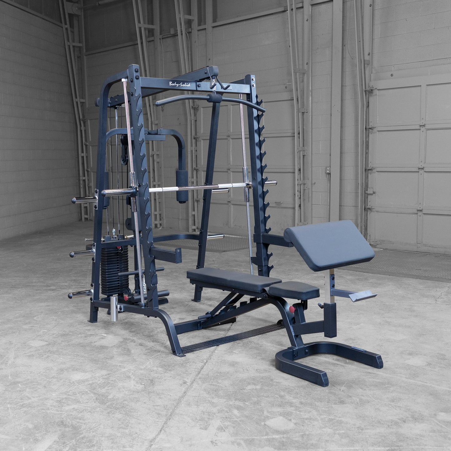 FID bench with leg developer and preacher curl attachments on Body-Solid GS348BP4 system