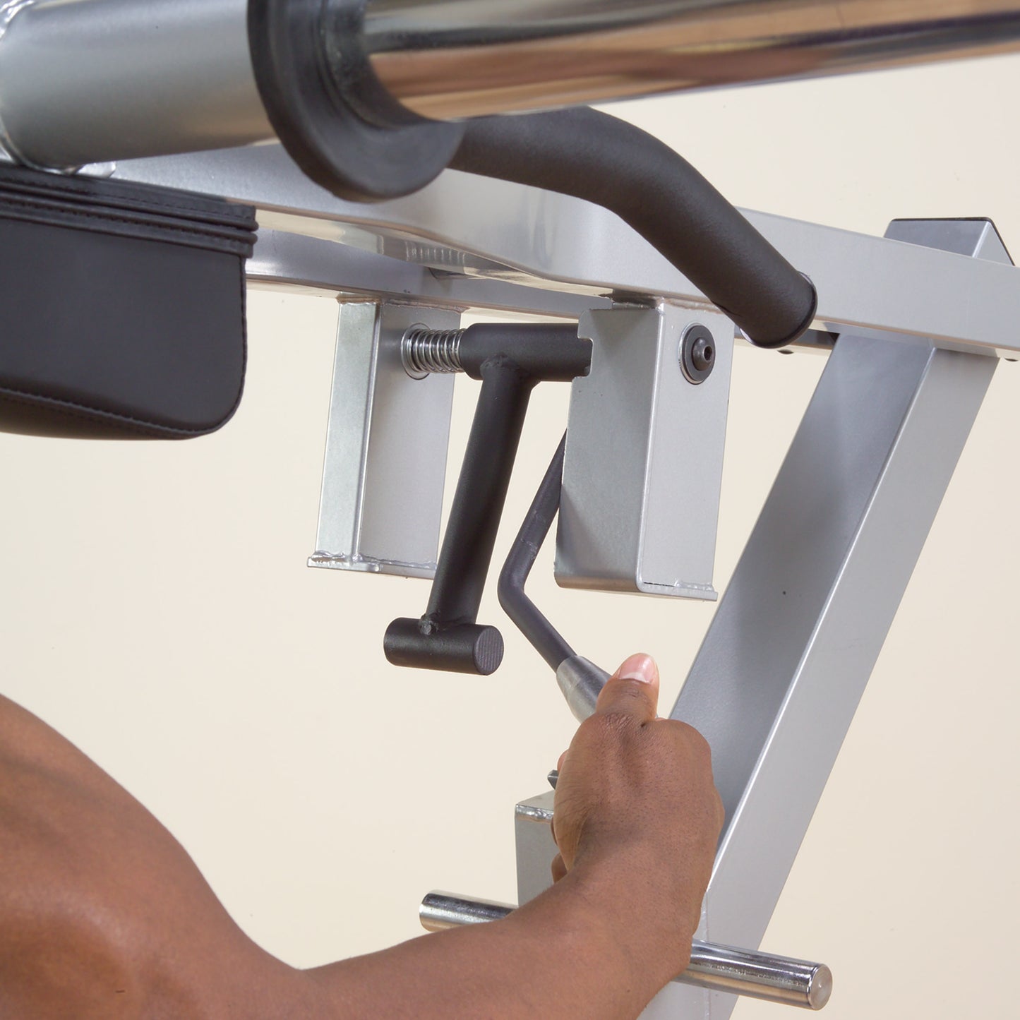 Adjustable leverage system on Body-Solid GSCL360 for squats and calf raises.