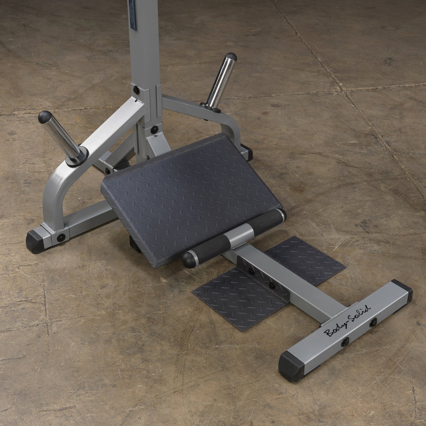 Close-up of textured footplate on Body-Solid GSCL360 for secure footing.