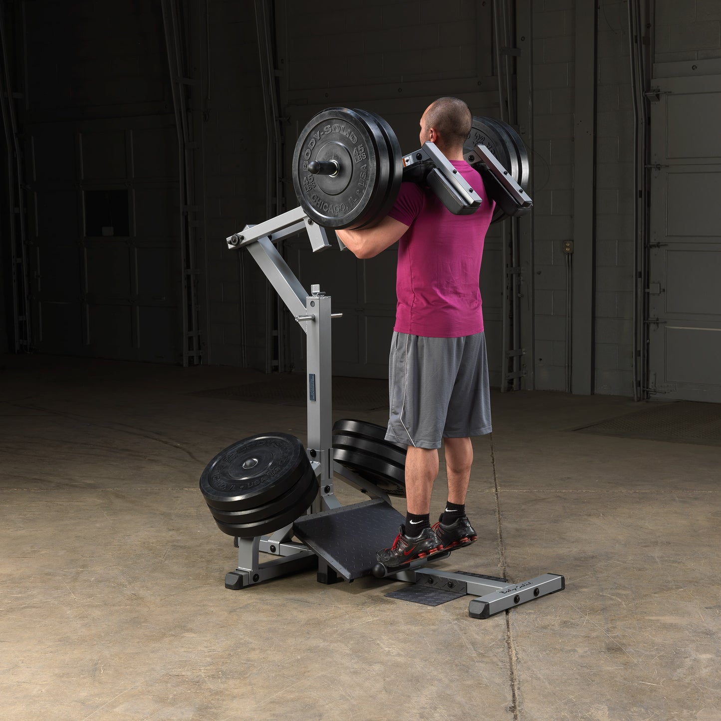 Standing calf raise exercise on Body-Solid GSCL360 Leverage Squat & Calf Machine.
