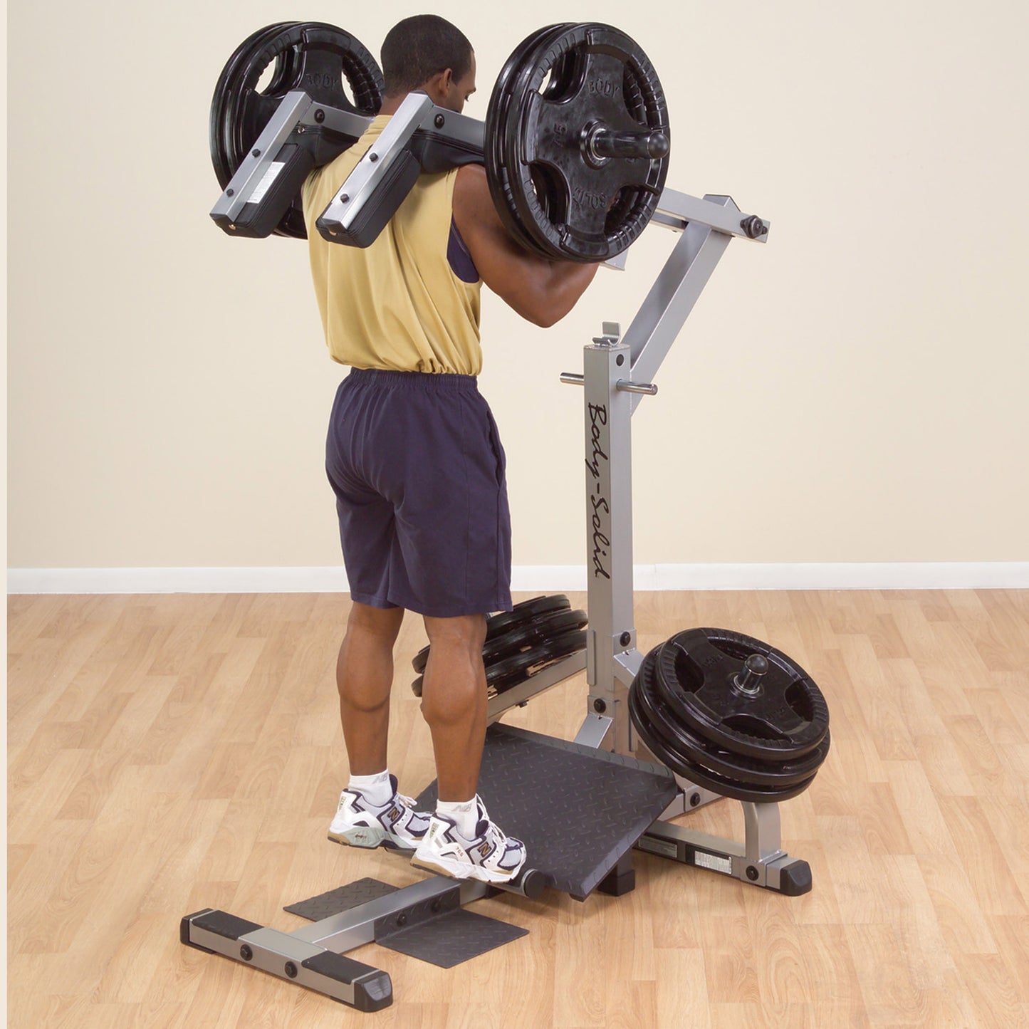 Standing calf raise exercise on Body-Solid GSCL360 Leverage Squat & Calf Machine.
