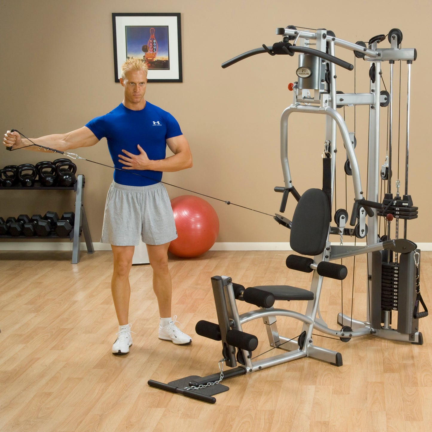 Person using the Body-Solid Powerline P2X Home Gym for cable workout