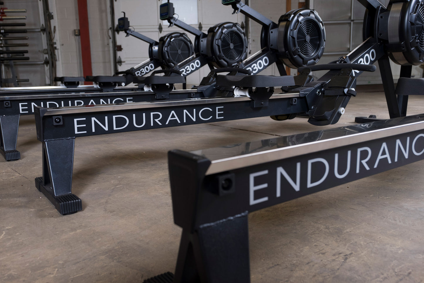 Ergonomic padded seat and aluminum rail on Body-Solid R300 indoor rowing machine