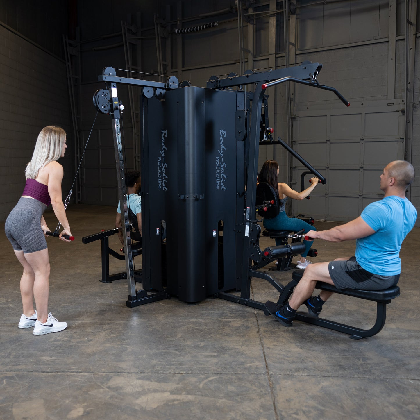 Four Users Training Simultaneously on Body-Solid S1000 4-Stack Gym