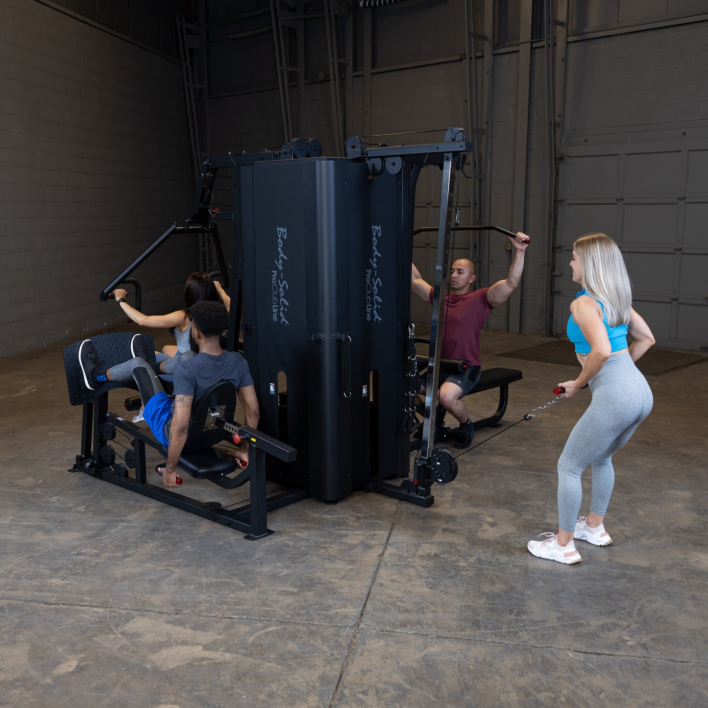 Four Users Training Simultaneously on Body-Solid S1000 4-Stack Gym
