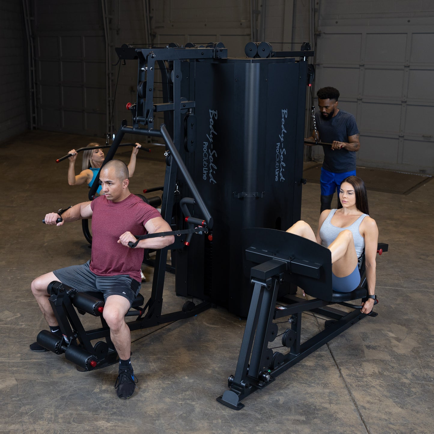 Four Users Training Simultaneously on Body-Solid S1000 4-Stack Gym