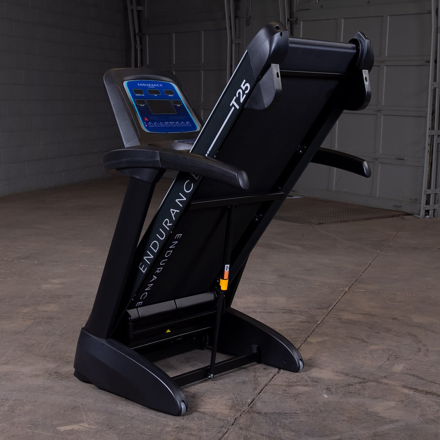 Body-Solid T25 treadmill folded upright for easy home storage.