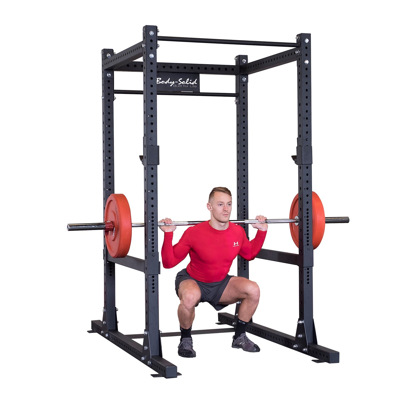 Man performing squats with Body-Solid SPR1000