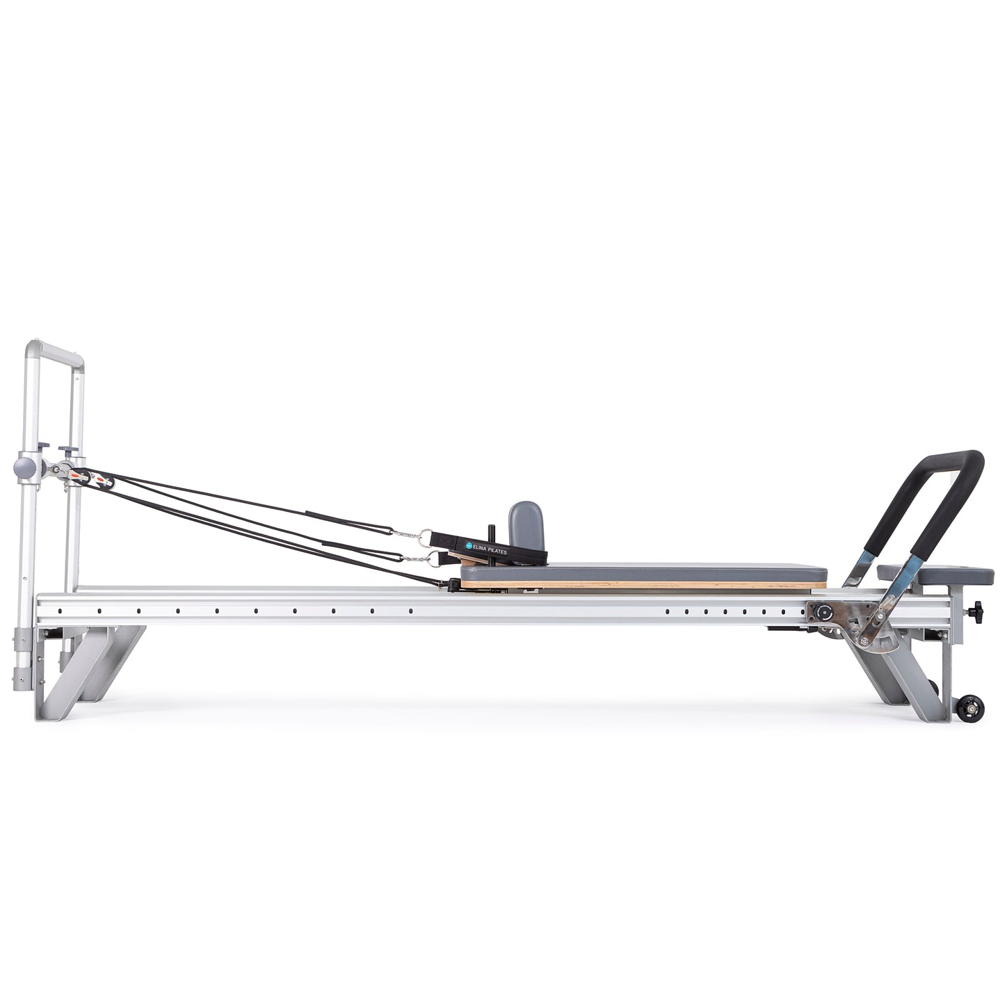 Side view of the Elina Pilates Aluminum Reformer Mentor in grey upholstery with accessories attached