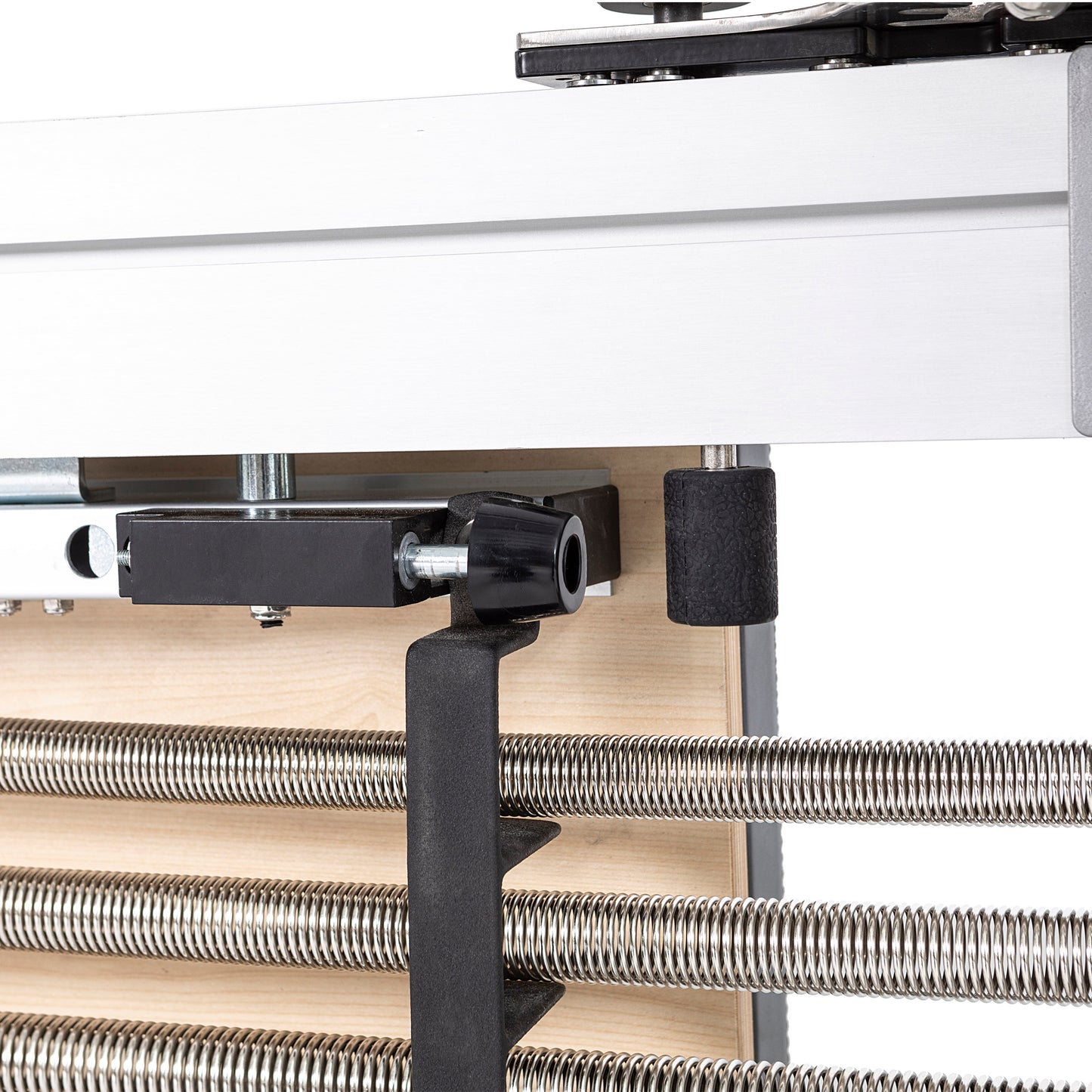 Close-up of spring attachment points on the Elina Pilates Aluminum Reformer Mentor for resistance customization