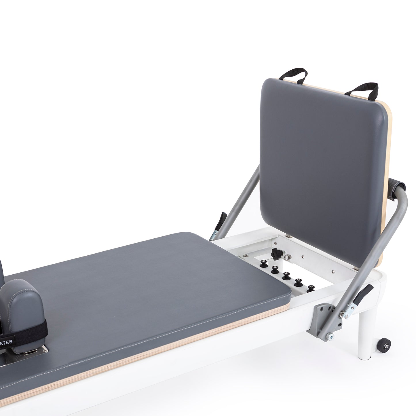 Close-up of the padded, adjustable footbar with cushioned damping on the Elina Pilates Nubium Reformer