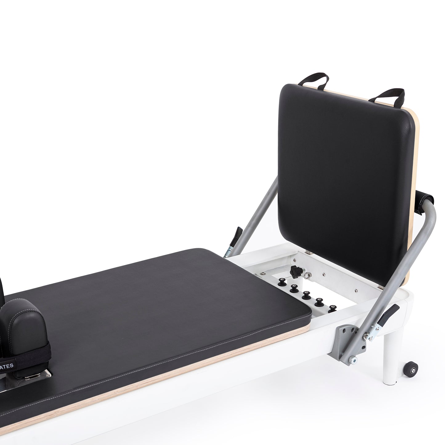 Close-up of the padded, adjustable footbar with cushioned damping on the Elina Pilates Nubium Reformer
