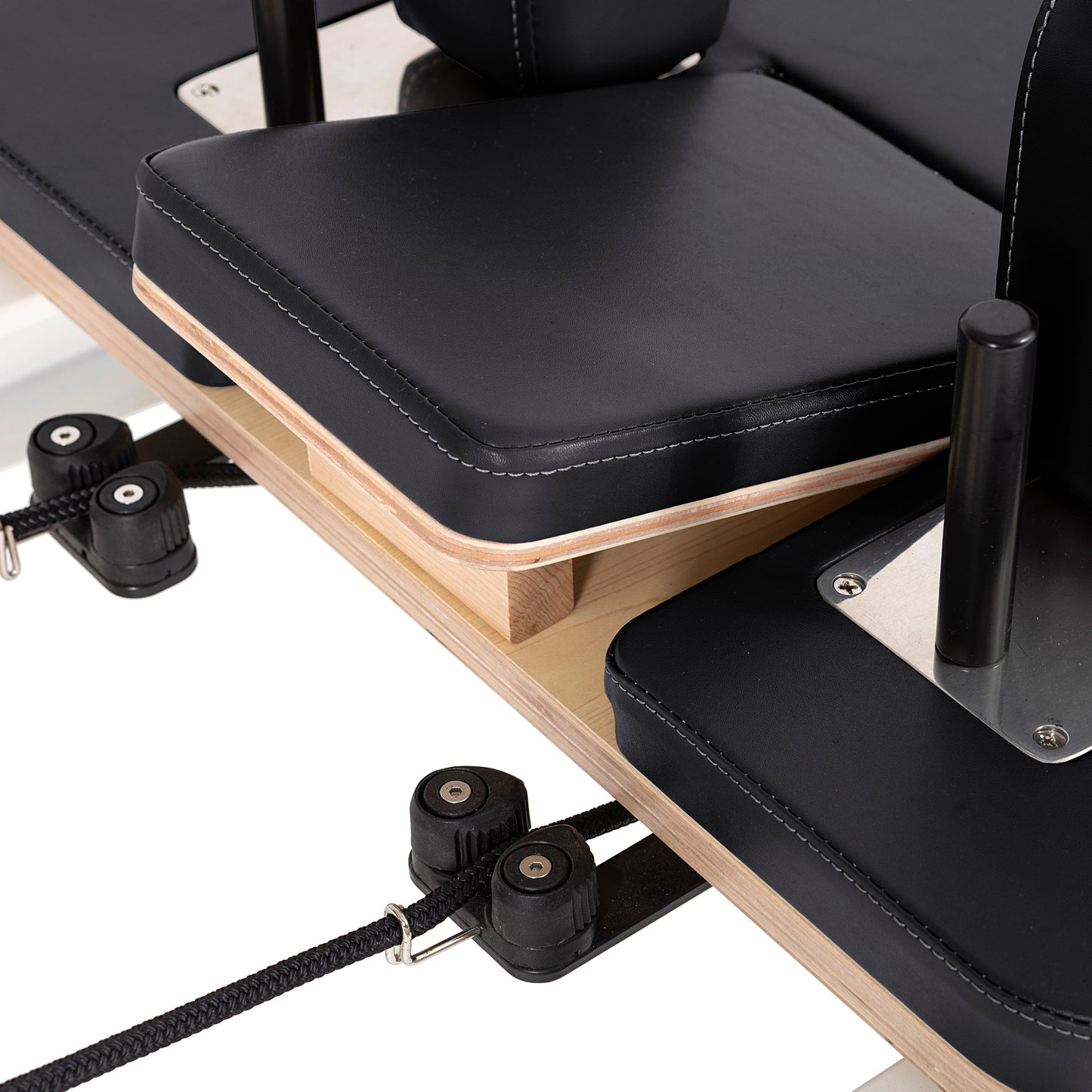Detail of the pulley posts and rope system on the Elina Pilates Nubium Reformer for customizable resistance