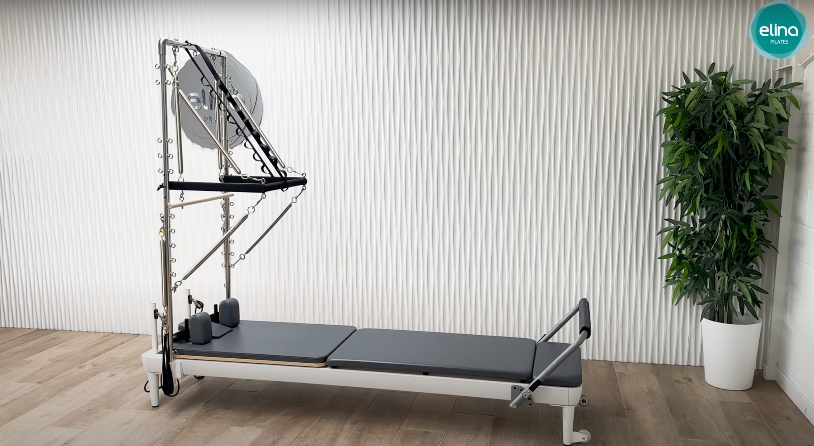 Elina Pilates Nubium™ Reformer with Tower Bundle in Black — full view showing sleek black aluminum frame and vertical storage design