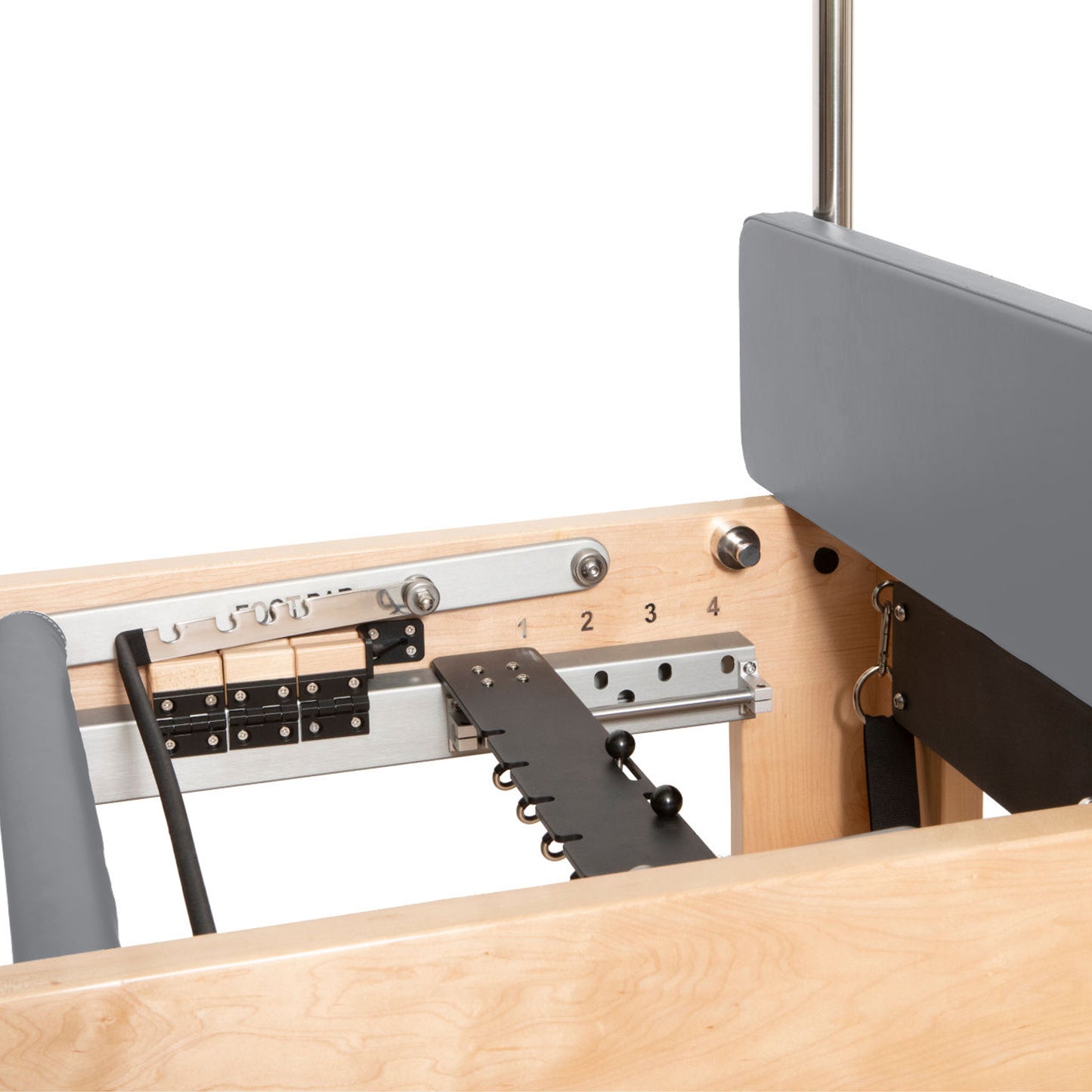 Adjustable push-through bar and springs attached to the Cadillac tower