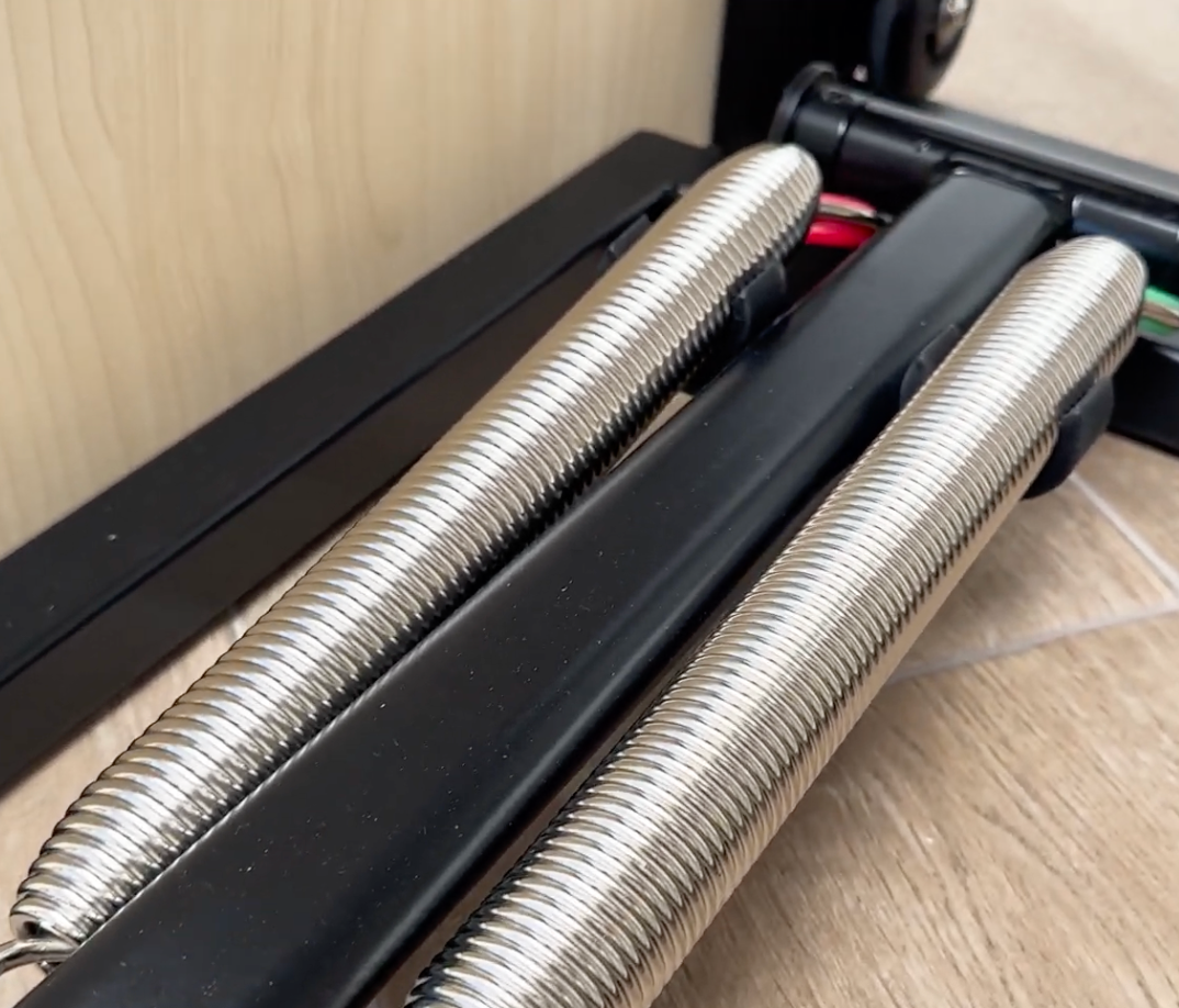 Close-up of spring resistance system on Elina Pilates Combo Chair