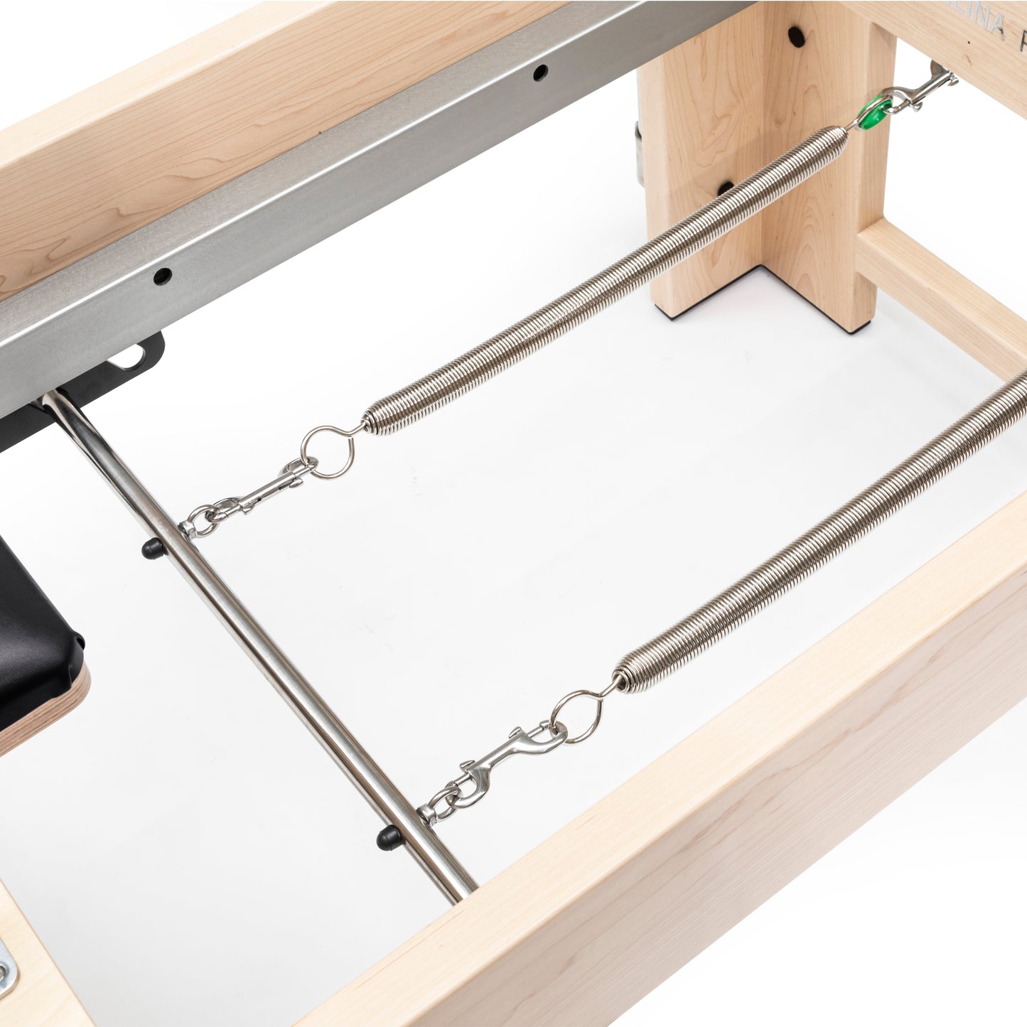 Close-up of the smooth eight-wheel carriage system and two-piece rail on the Elite Cadillac Reformer