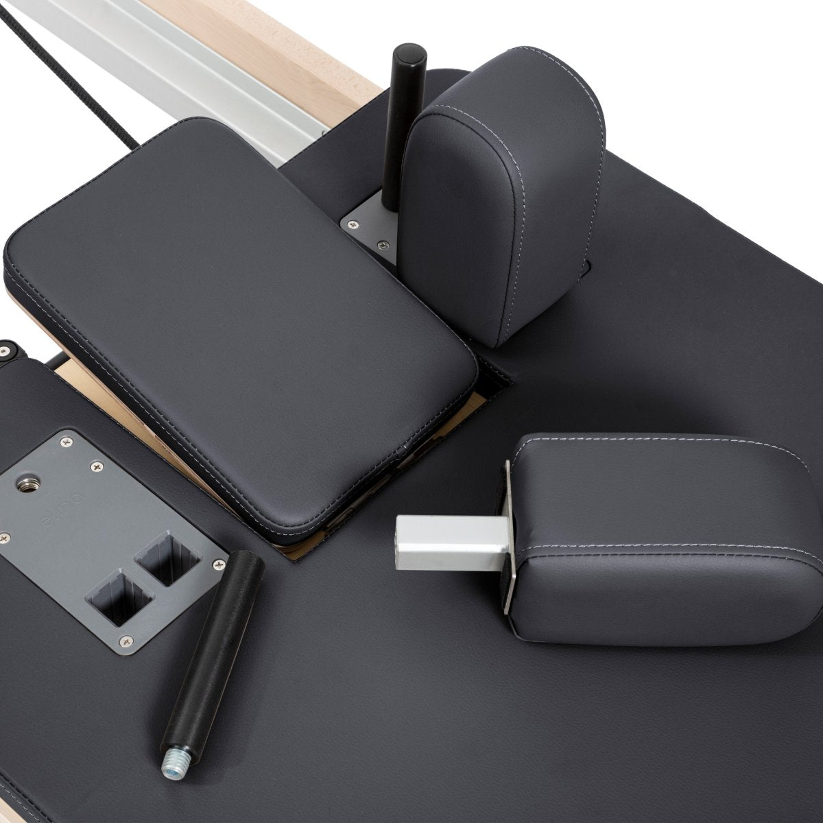 Close-up of adjustable shoulder pads on Elina Pilates Reformer