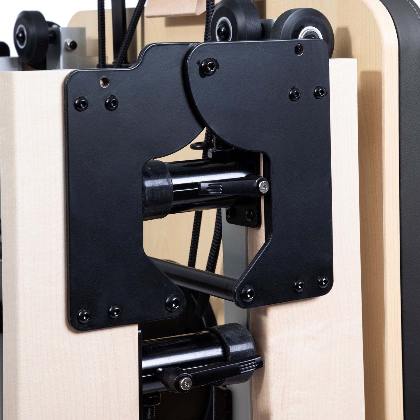 Close-up of American maple wood frame on Elina Pilates Reformer