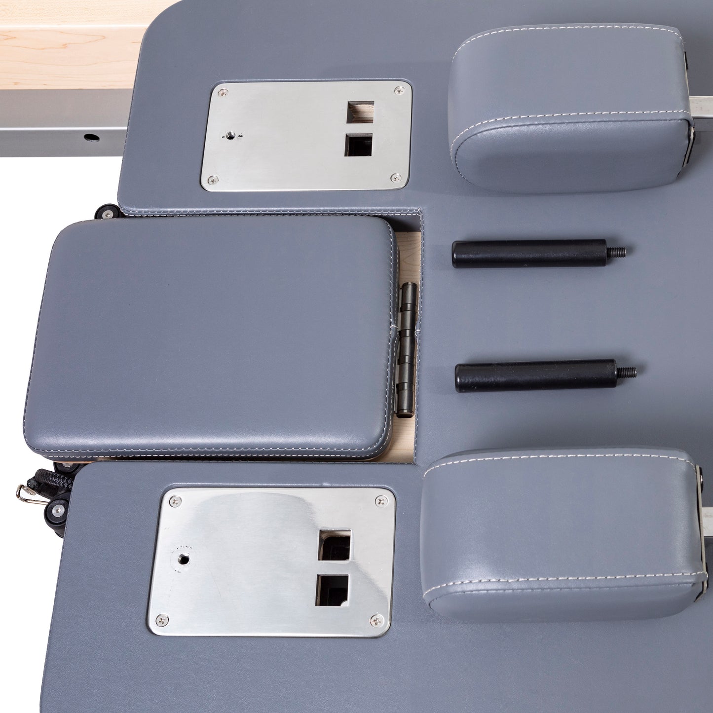 Padded shoulder rests with premium grey upholstery on the Master Instructor™ Pilates Reformer for enhanced comfort