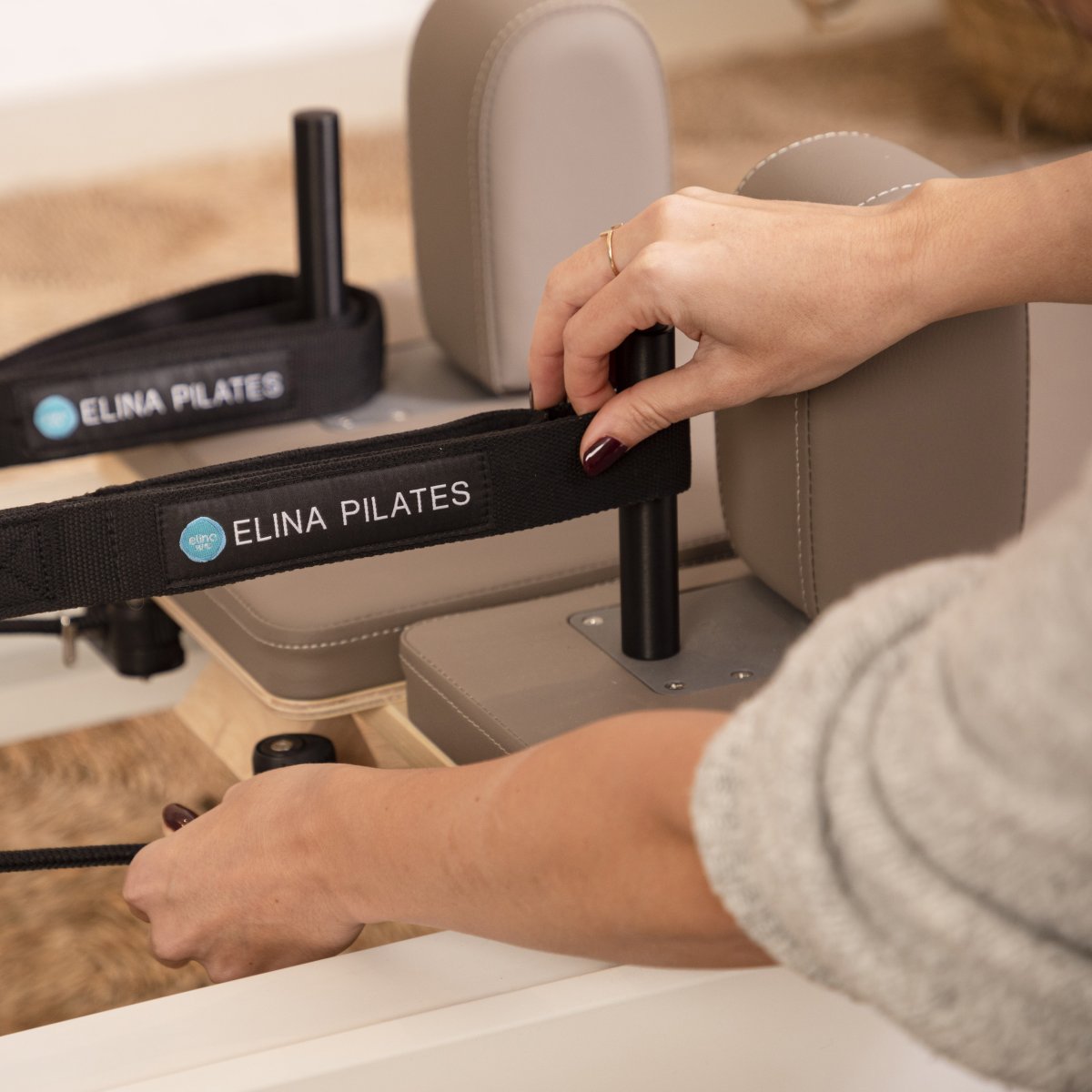 Detail of the pulley posts and rope system on the Elina Pilates Nubium Reformer for customizable resistance