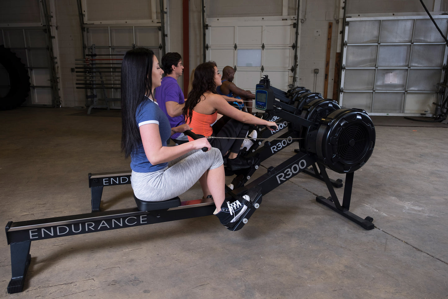 Users working out with the Endurance R300 Indoor Rower for full-body cardio workout