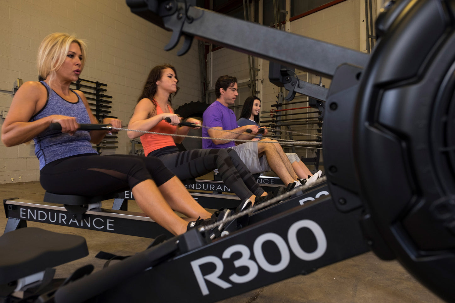Users working out with the Endurance R300 Indoor Rower for full-body cardio workout