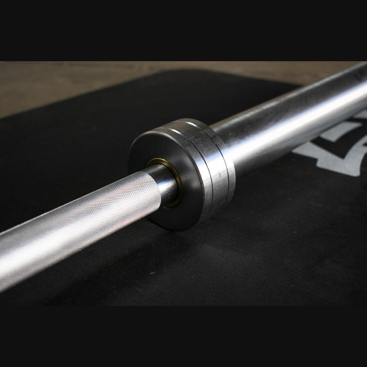Triple bearing sleeve turning smoothly on Olympic bar