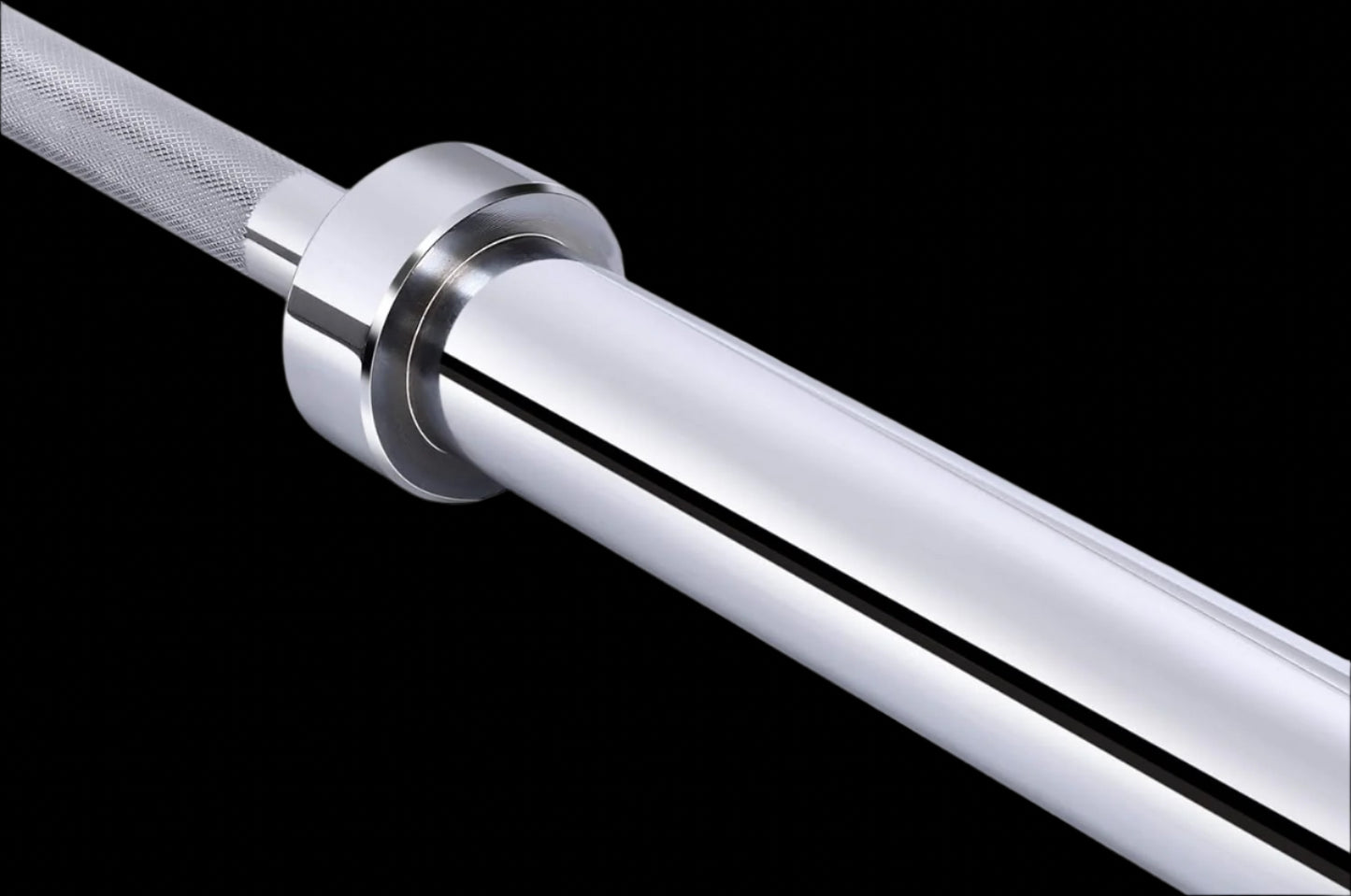 Close-up of Signature Fitness barbell sleeve showing needle-bearing assembly and 2-inch plate compatibility