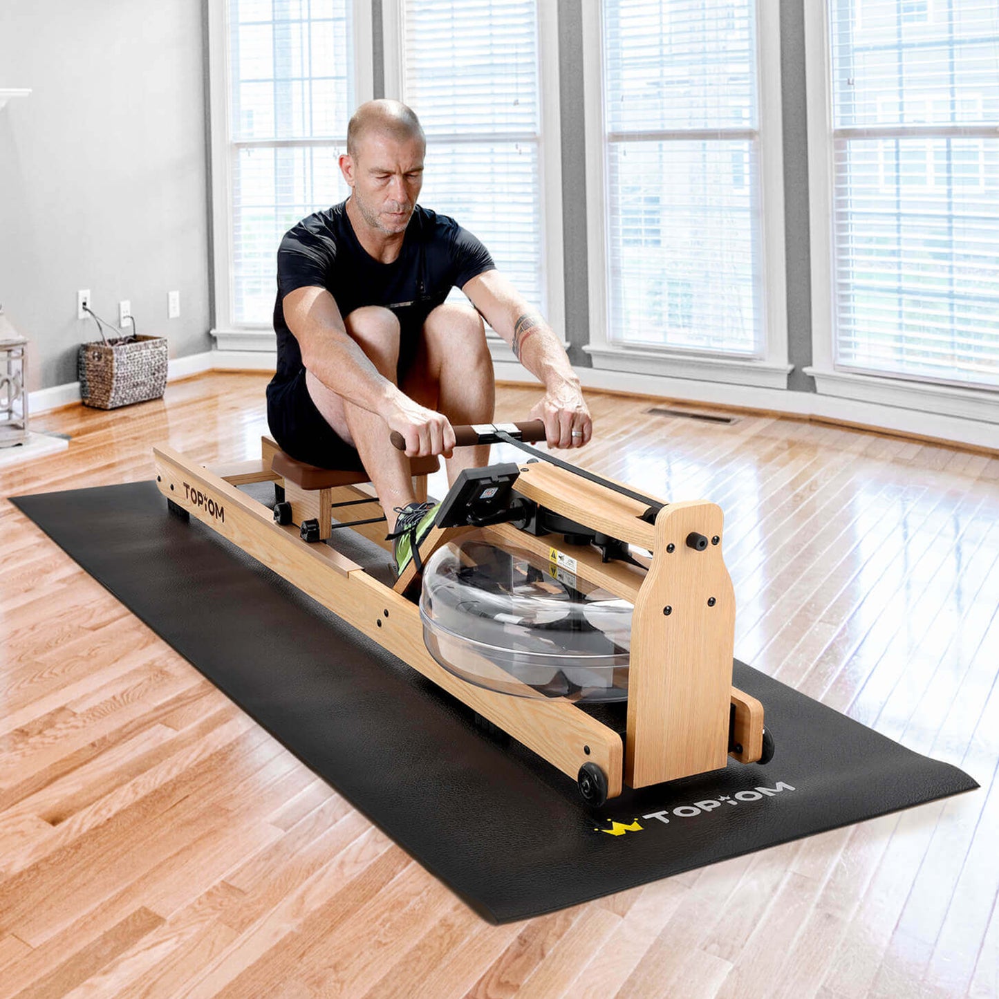 Person using rowing machine on Topiom non-slip fitness mat in home gym