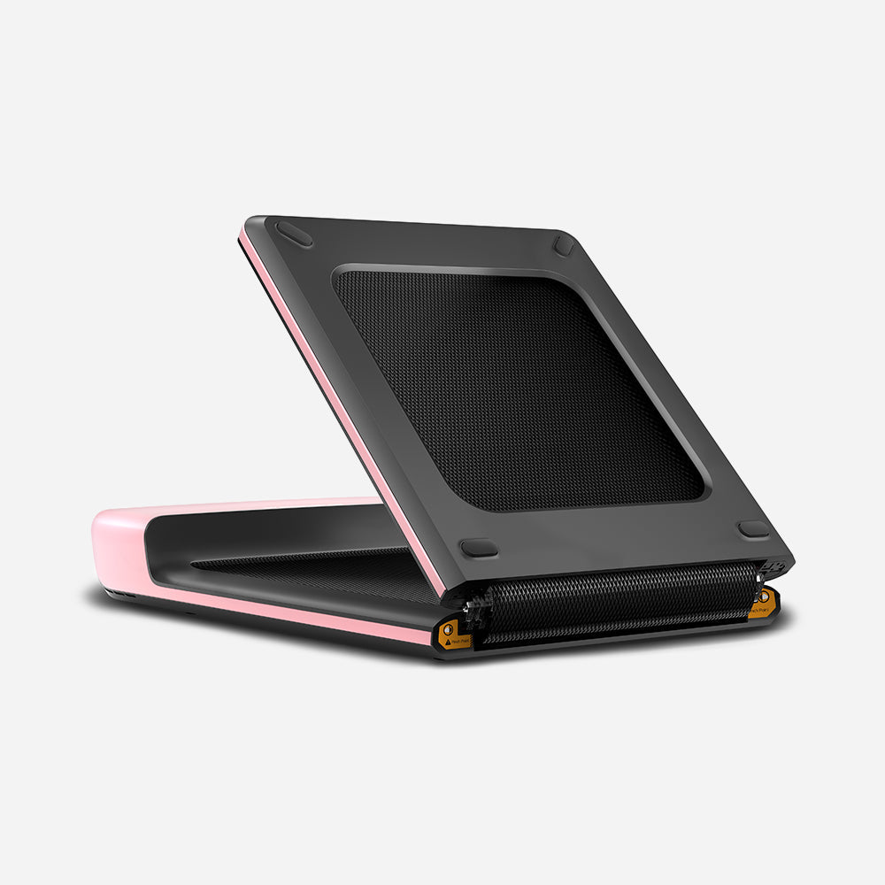 Full view of folded WalkingPad P1 Pink Foldable Treadmill