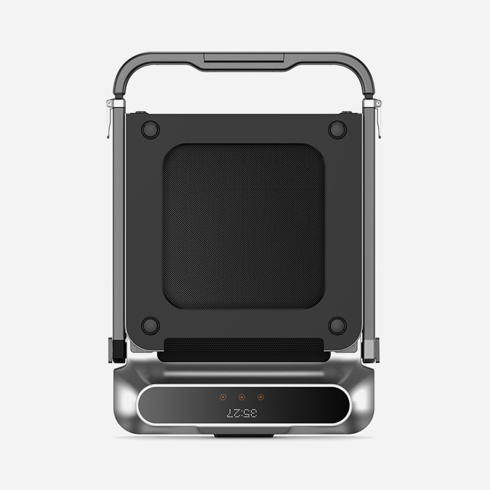 WalkingPad R2 folded vertically against a wall in compact storage