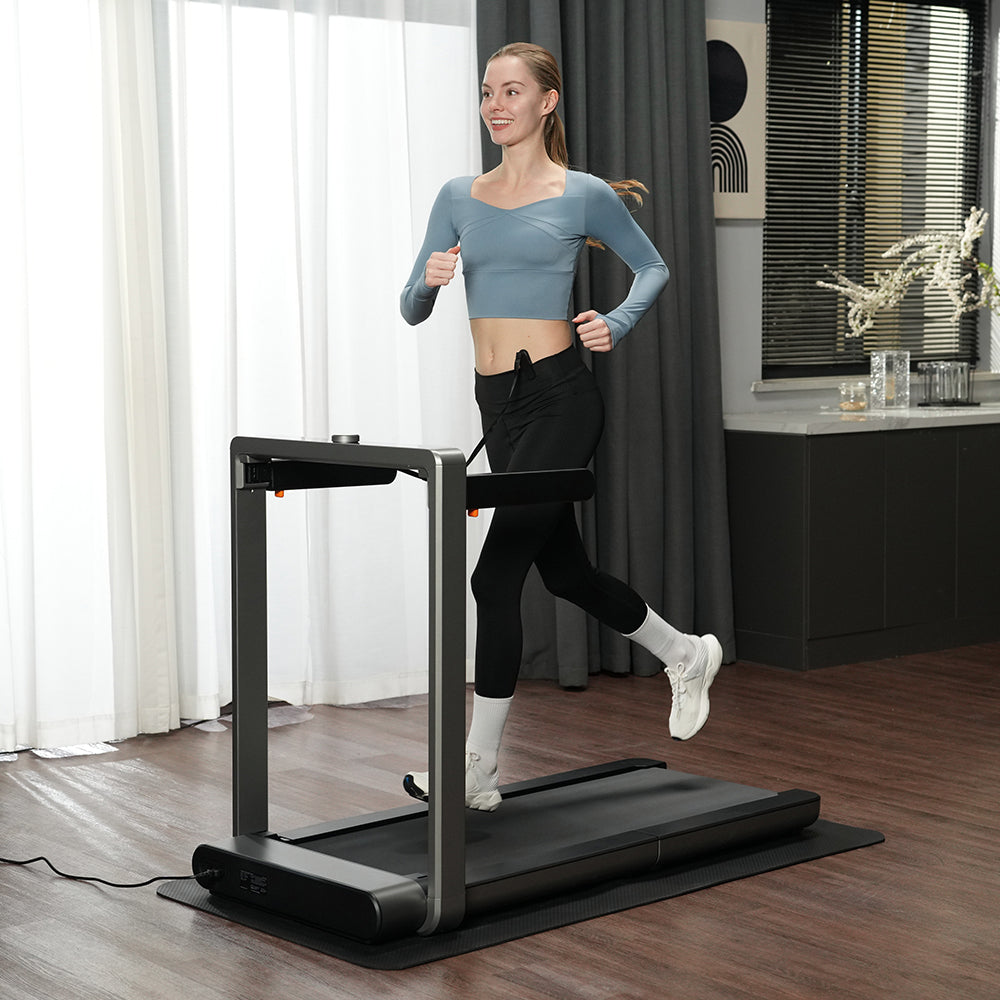 Woman running with the WalkingPad X214 treadmill in her home