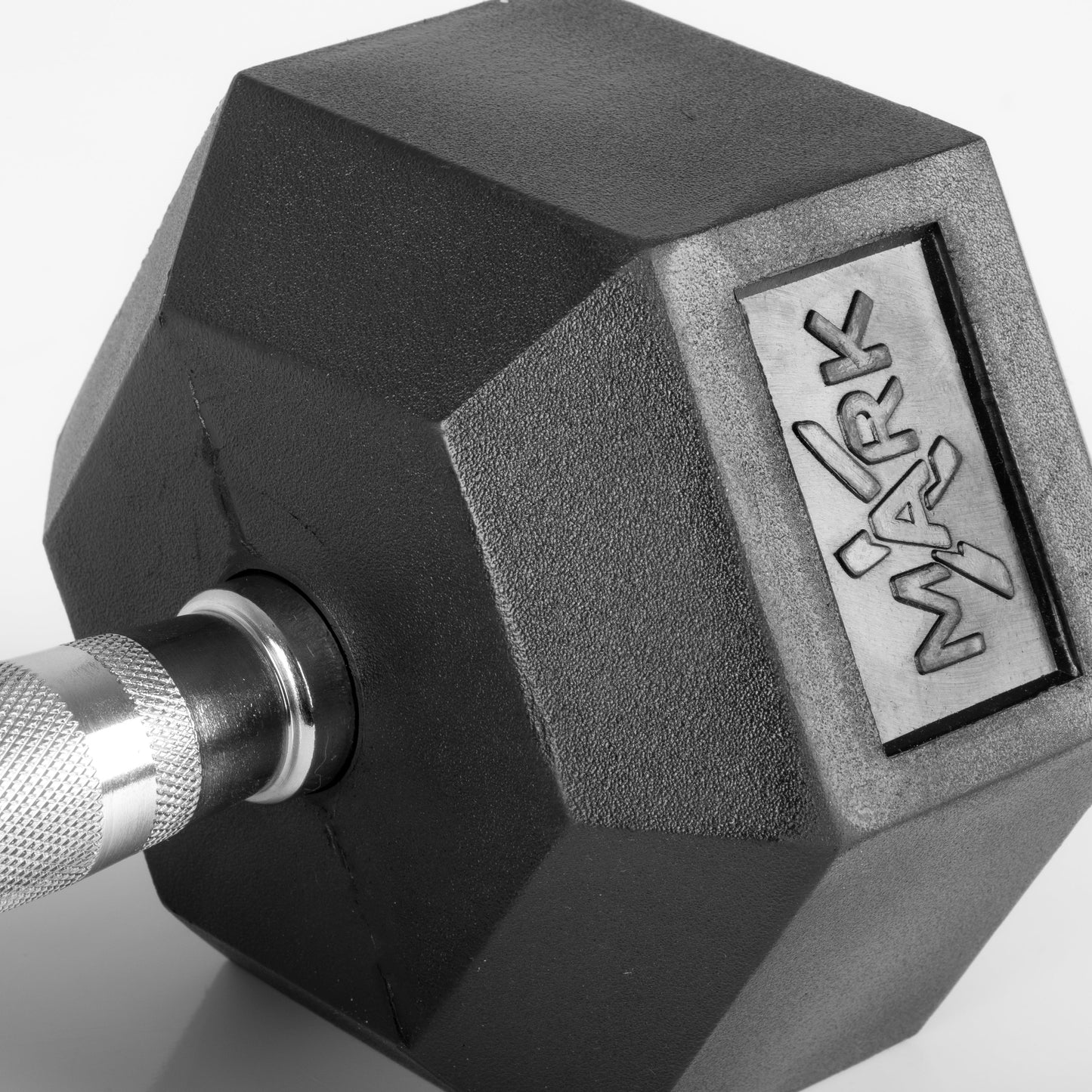 Close-up of rubber hex dumbbell head and chrome-plated knurled handle