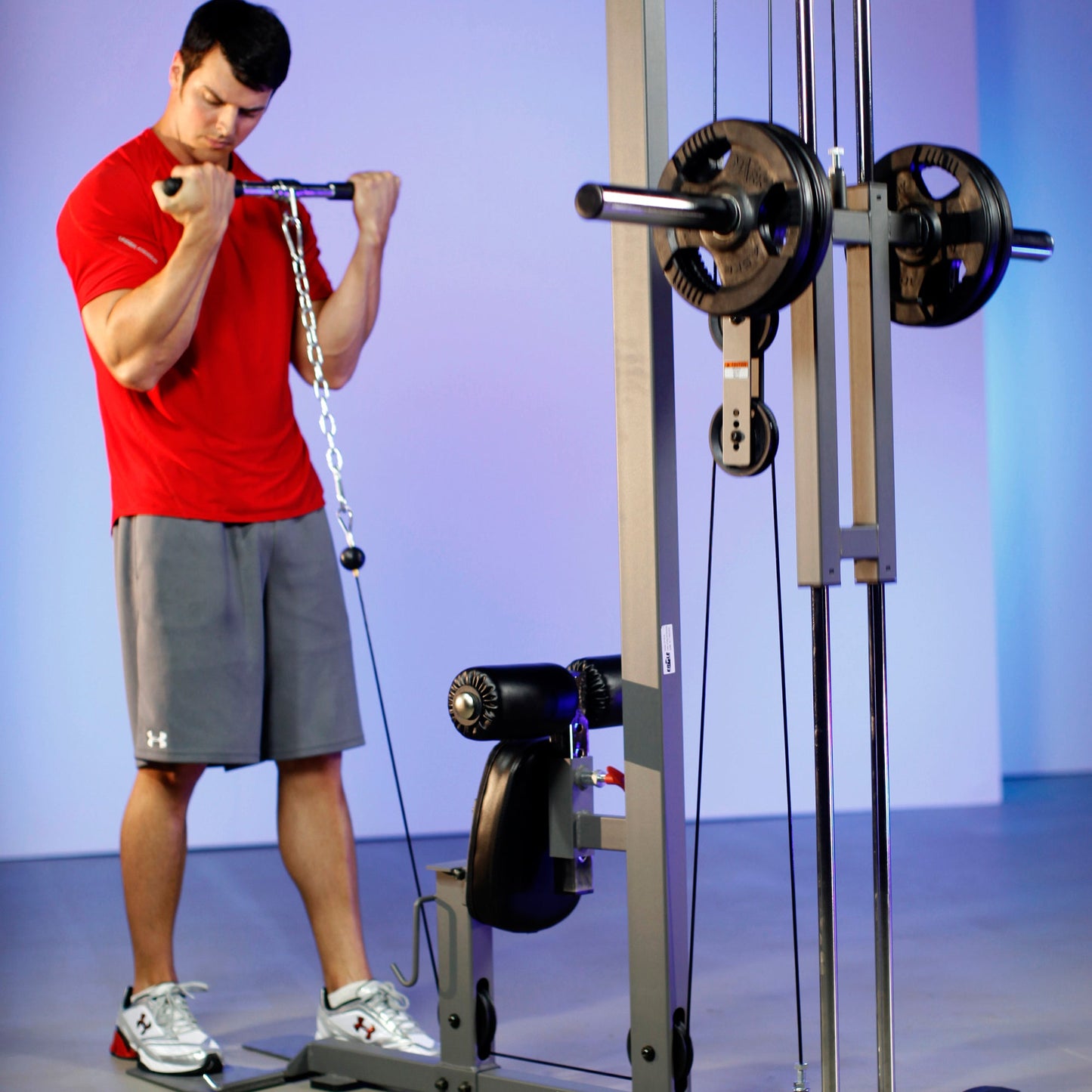 Bicep curl on the XMark Lat Pull‑Down Machine with Low‑Row station