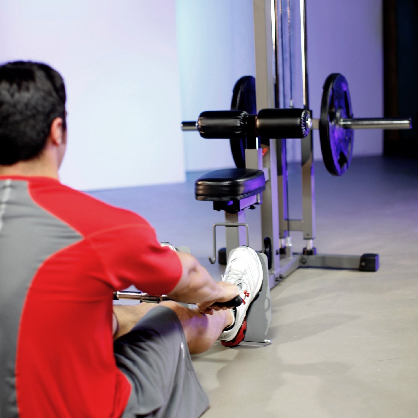 Low rows on the XMark Lat Pull‑Down Machine with Low‑Row station