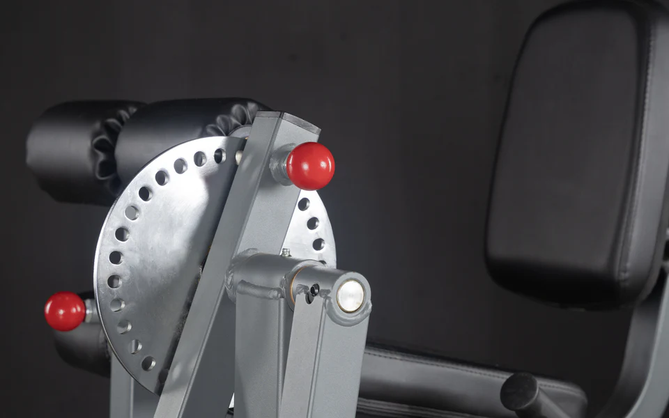 Close-up of adjustment mechanism for the XMark Rotary Leg Extension and Curl Machine